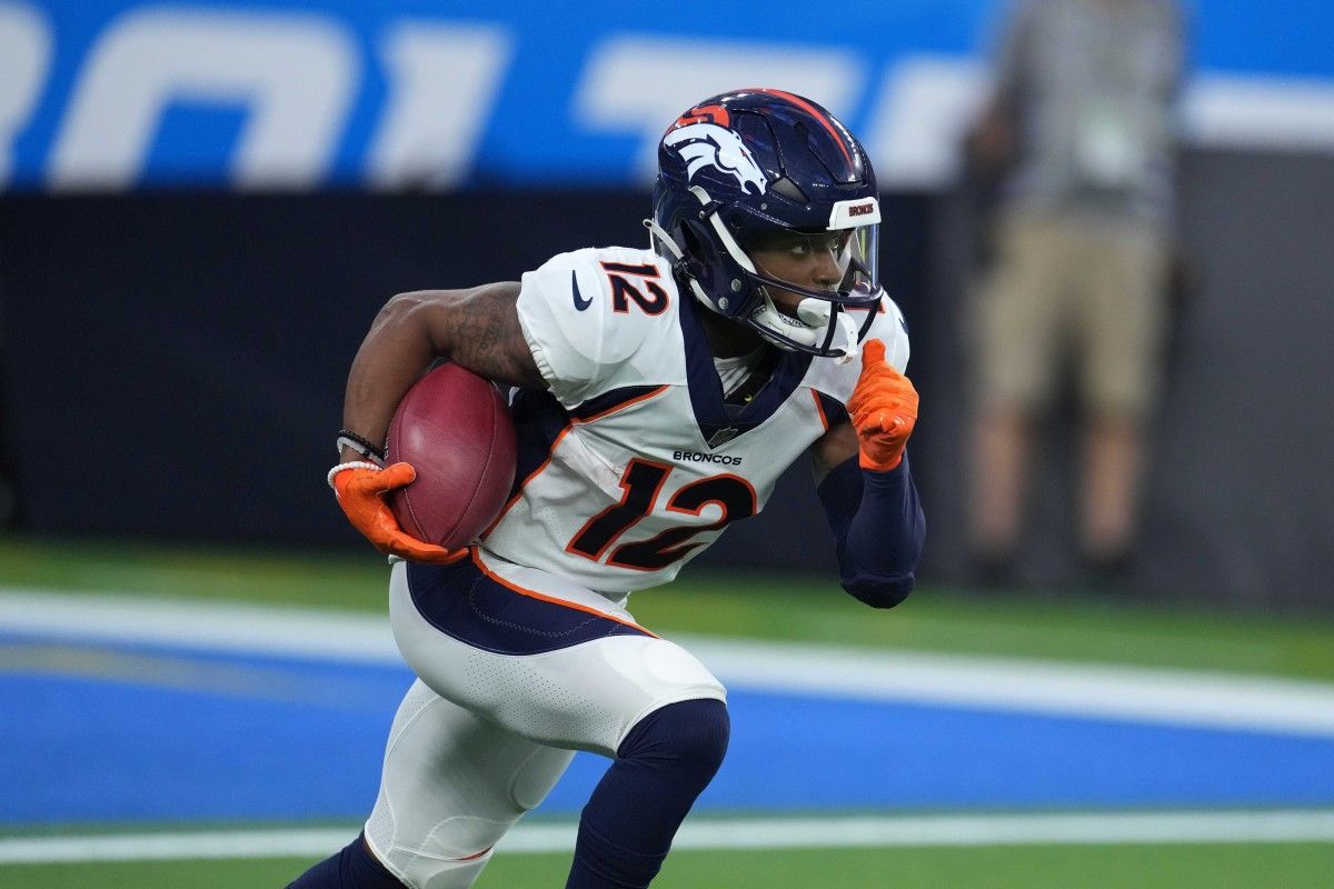Denver Broncos wide receiver Montrell Washington (12) carries the ball on a kickoff return against the Los Angeles Chargers at SoFi Stadium. The Chargers defeated the Broncos 19-16 in overtime.