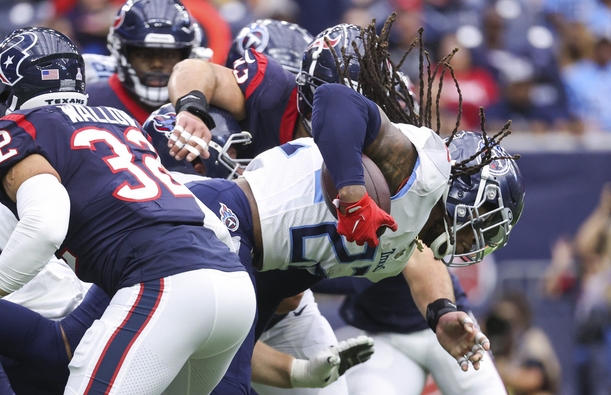 Oct 30, 2022; Houston, Texas, USA; Tennessee Titans running back Derrick Henry (22) runs with the ball during the first quarter against the Houston Texans at NRG Stadium. Mandatory Credit: Troy Taormina-USA TODAY Sports