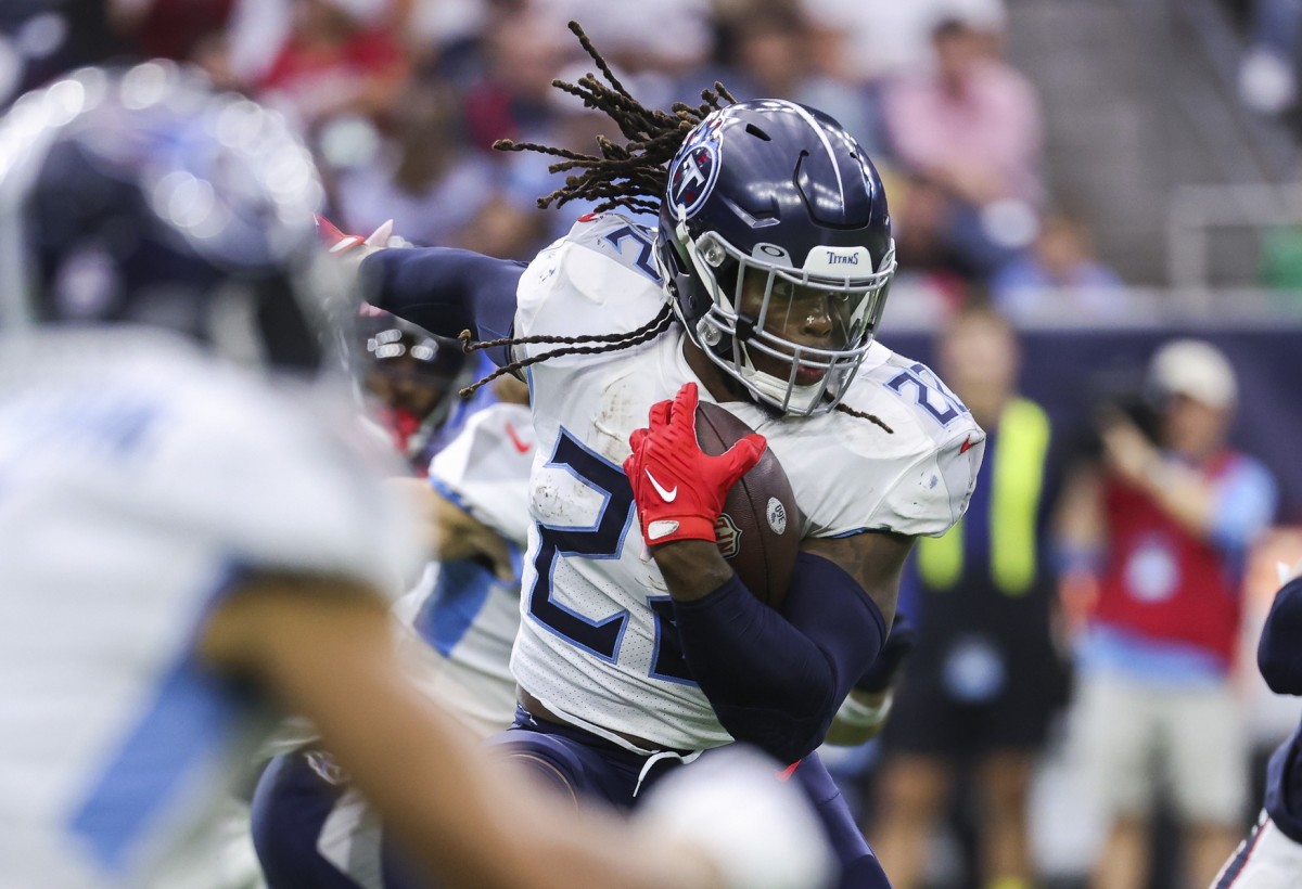 Tennessee Titans running back Derrick Henry (22) runs with the ball during the second quarter against the Houston Texans at NRG Stadium.