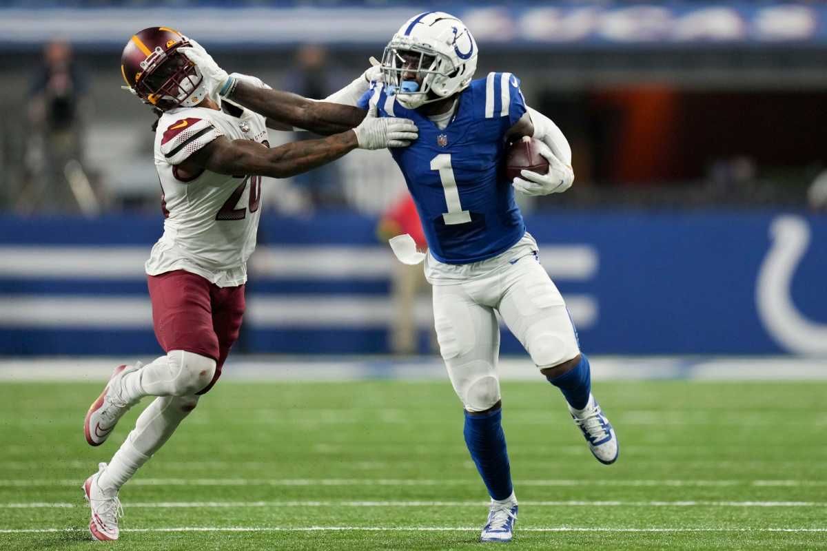 Indianapolis Colts wide receiver Parris Campbell (1) stiff arms Washington Commanders safety Bobby McCain (20) as he rushes the ball Sunday, Oct. 30, 2022, during a game against the Washington Commanders at Indianapolis Colts at Lucas Oil Stadium in Indianapolis.