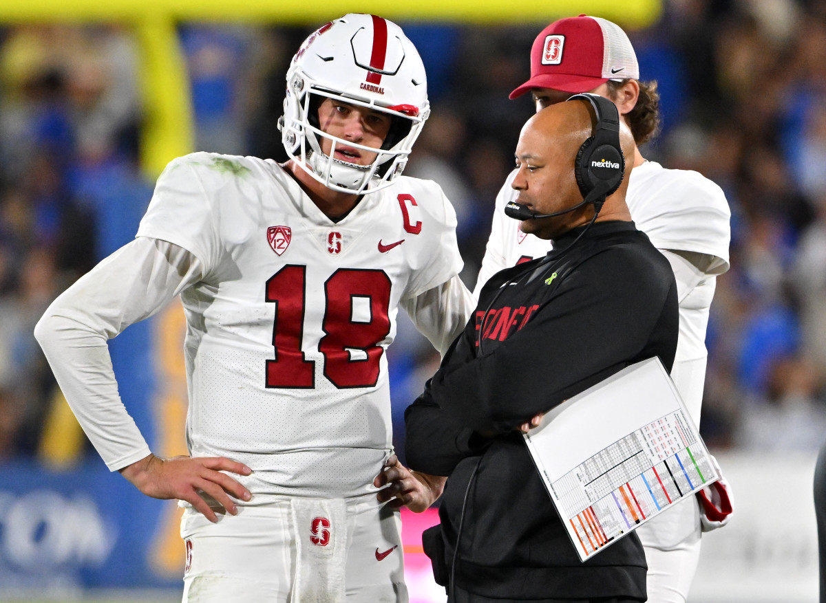 Stanford Cardinal head coach David Shaw talks with quarterback Tanner McKee (18) during a time out in the first half against the UCLA Bruins at the Rose Bowl.