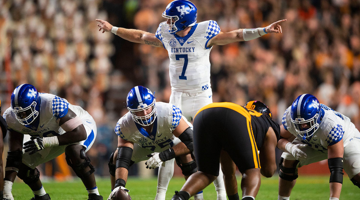 Kentucky QB Will Levis motions to his receivers before taking a snap.