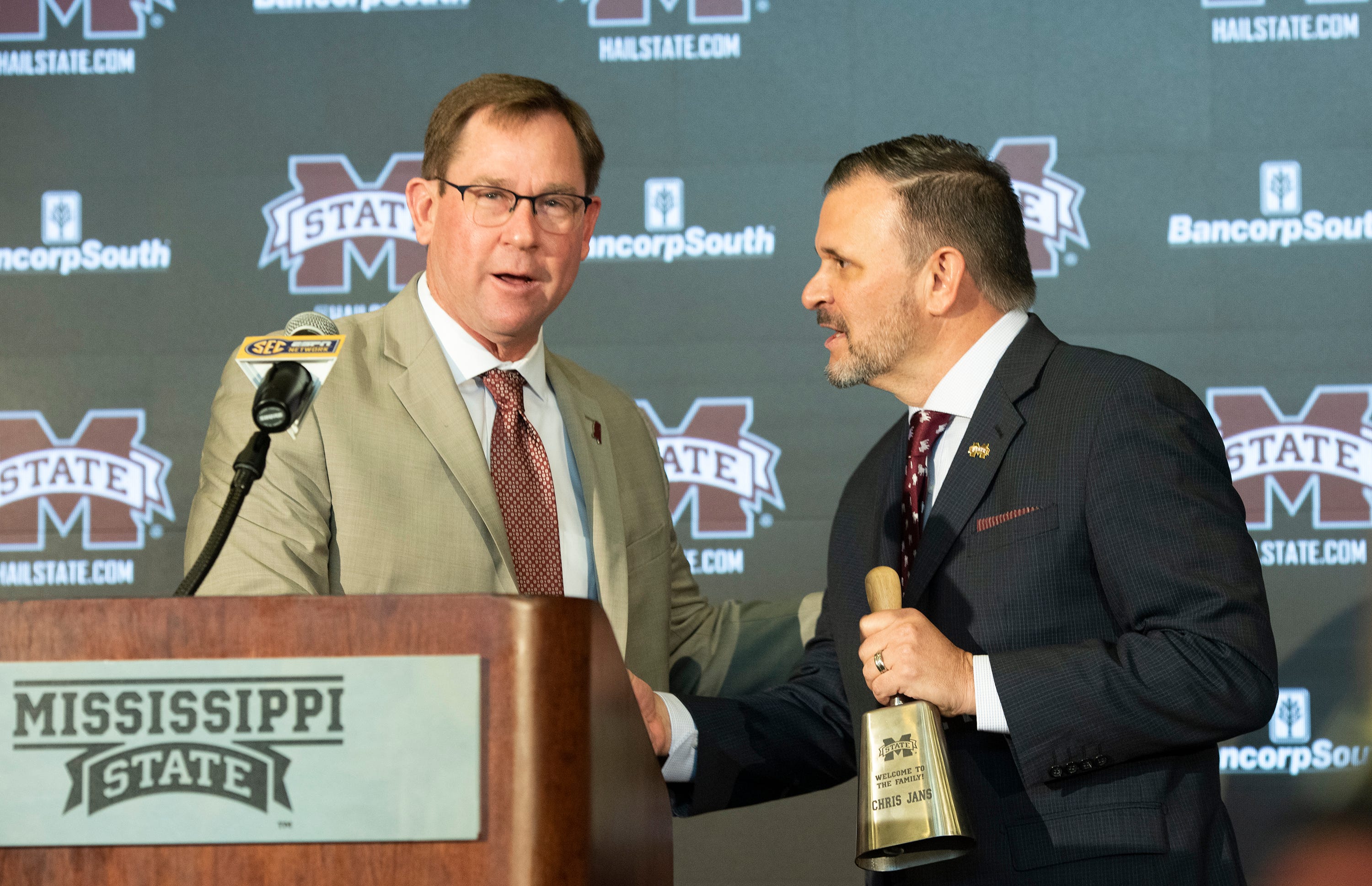 Mississippi State Athletic Director John Cohen, left, introduces new MSU basketball coach Chris Jans, right, during a news conference at MSU in Starkville Wednesday. March 23, 2022. Tcl Msu Chris Jans 03