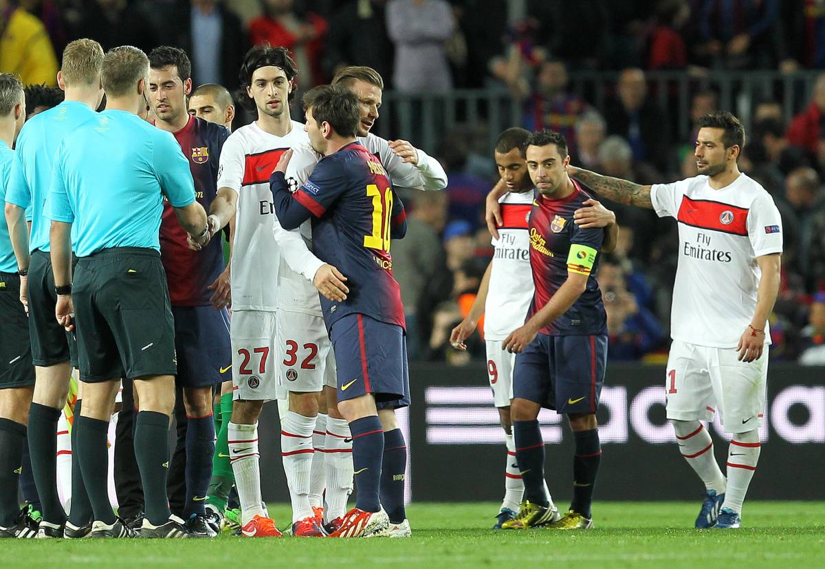 Lionel Messi pictured (center) hugging David Beckham after a Champions League game between Barcelona and PSG in 2013