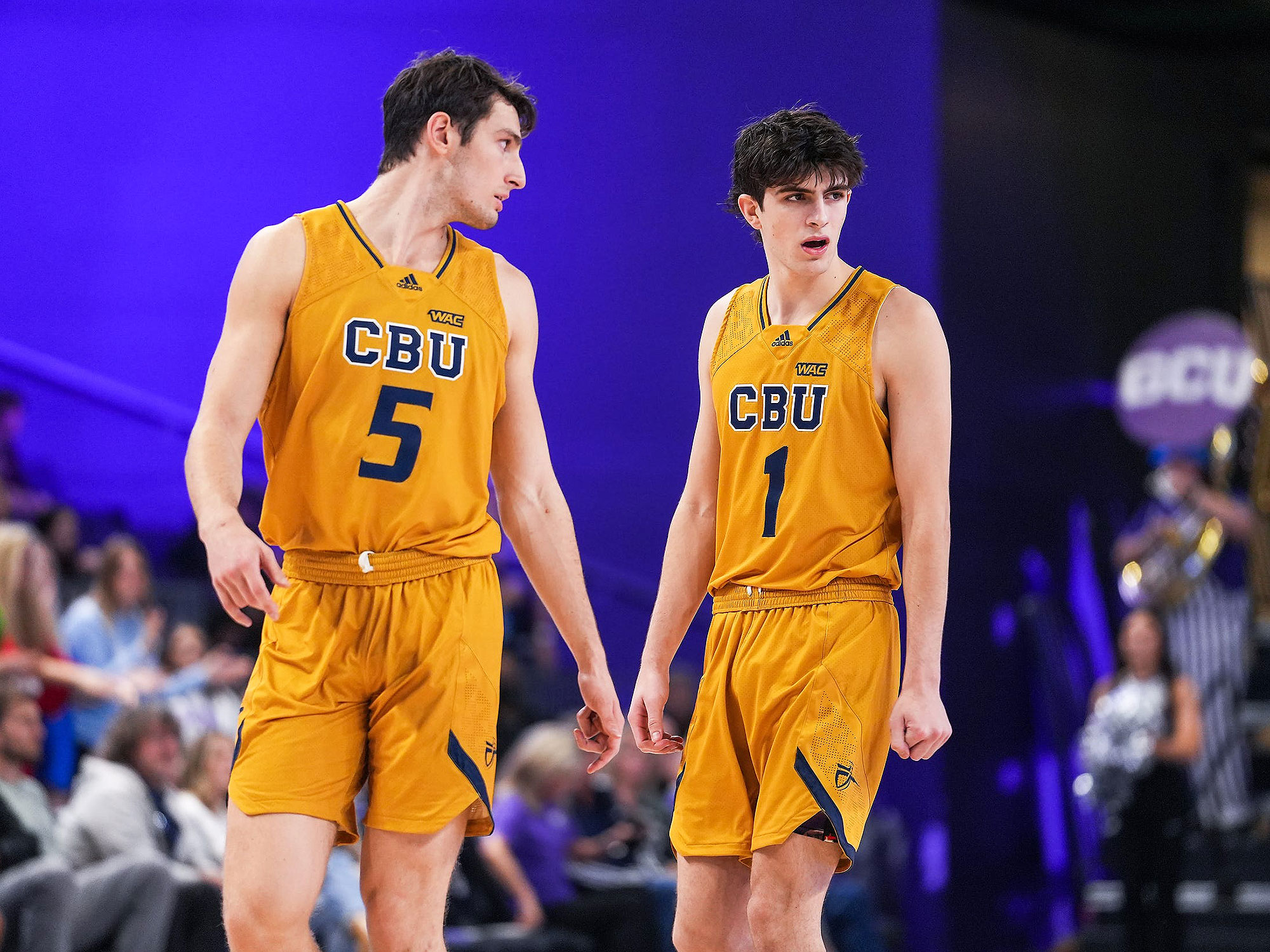 California Baptist’s Reed Nottage and Taran Armstrong walk on the court
