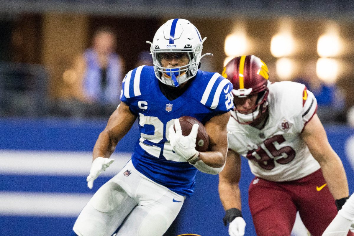 Oct 30, 2022; Indianapolis, Indiana, USA; Indianapolis Colts running back Jonathan Taylor (28) runs the ball in the first quarter against the Washington Commanders at Lucas Oil Stadium.