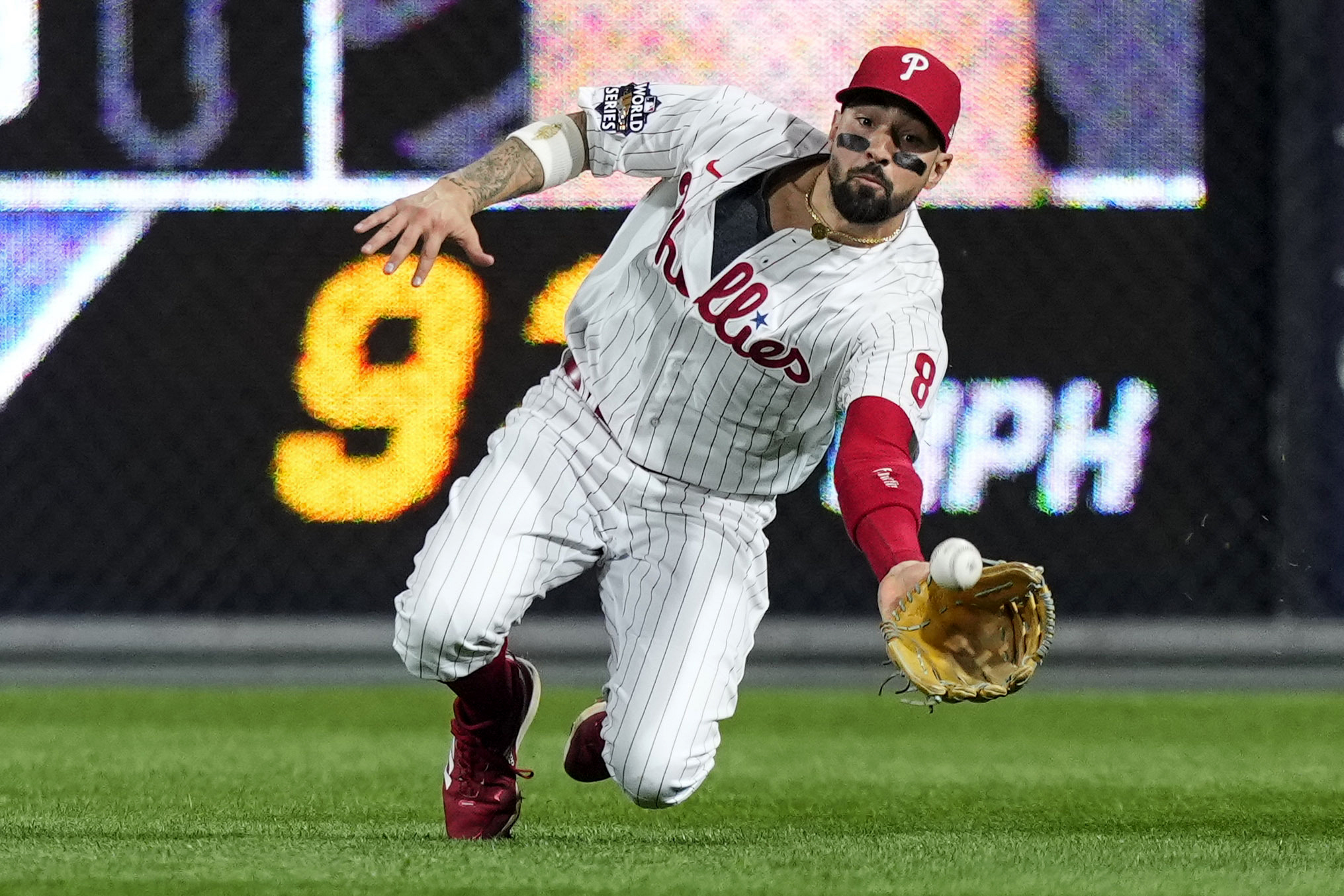 Philadelphia Phillies right fielder Nick Castellanos makes a diving catch during Game 3 of the 2022 World Series.