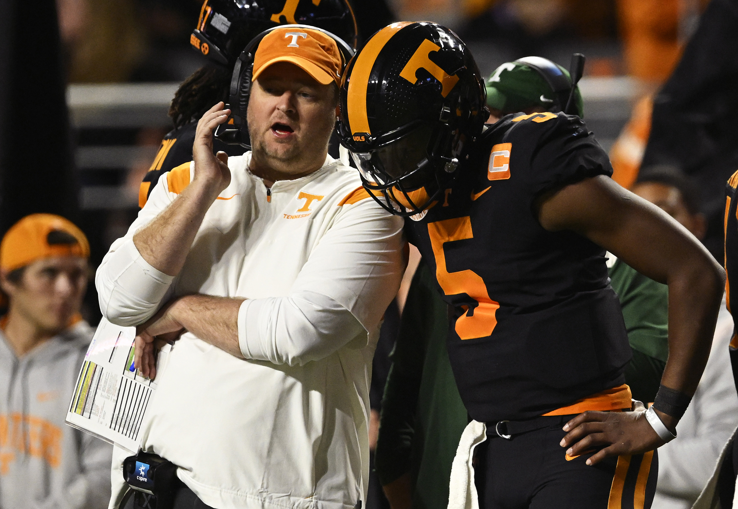 Josh Heupel talks through a play with QB Hendon Hooker.