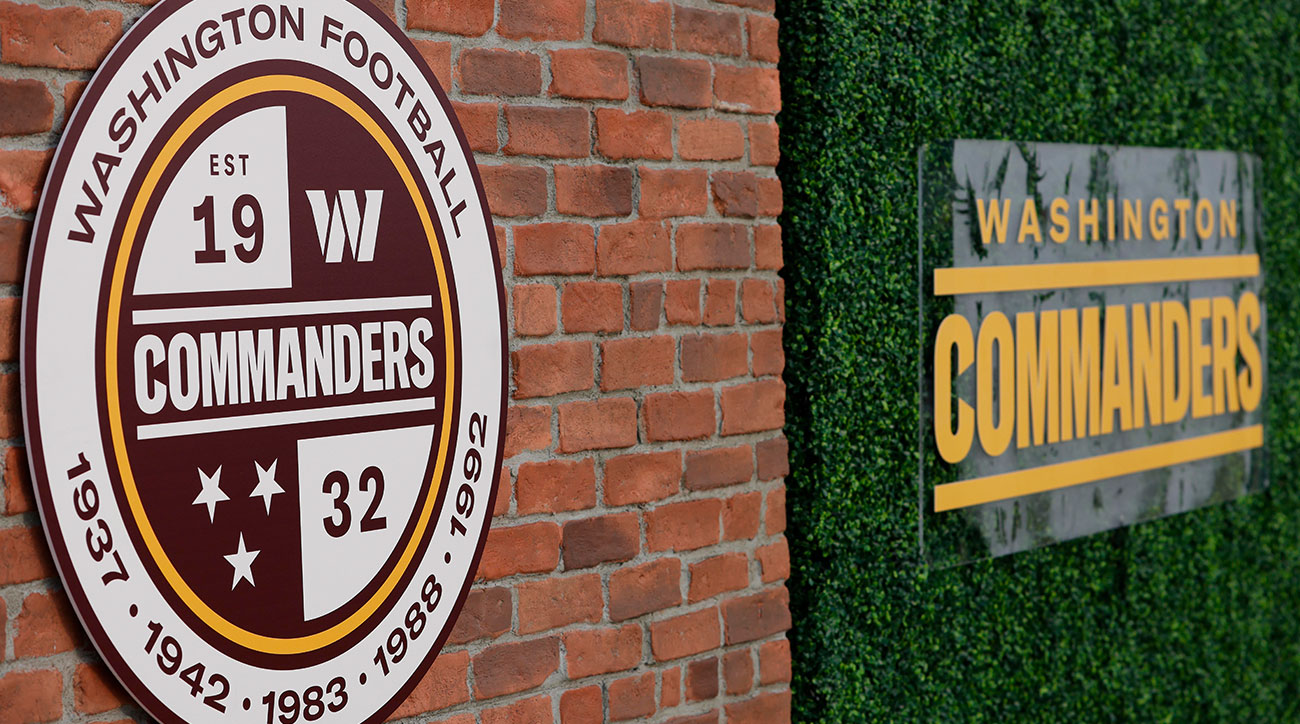 The Washington Commanders logo on the side of a brick building.