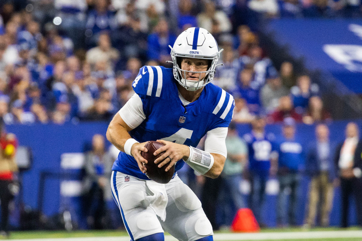 Oct 30, 2022; Indianapolis, Indiana, USA; Indianapolis Colts quarterback Sam Ehlinger (4) runs the ball in the second quarter against the Washington Commanders at Lucas Oil Stadium. Mandatory Credit: Trevor Ruszkowski-USA TODAY Sports