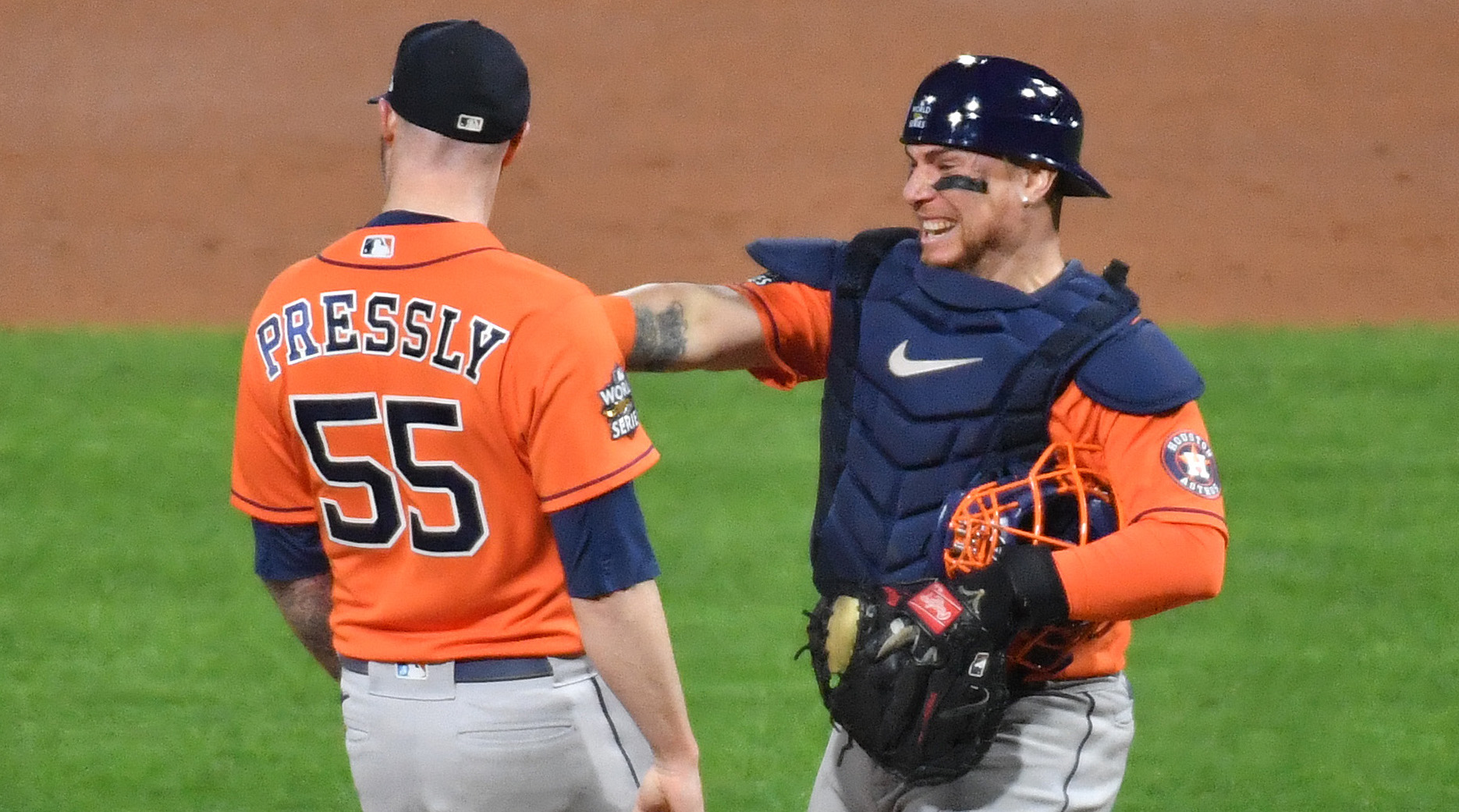 Astros pitcher Ryan Pressly celebrates with catcher Christian Vazquez after the final out of Game 4 of the 2022 World Series.