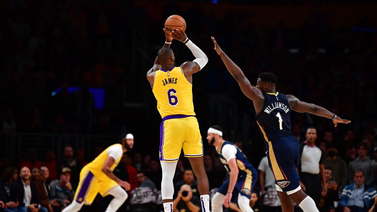 Nov 2, 2022; Los Angeles, California, USA; Los Angeles Lakers forward LeBron James (6) shoots against New Orleans Pelicans forward Zion Williamson (1) during overtime at Crypto.com Arena.