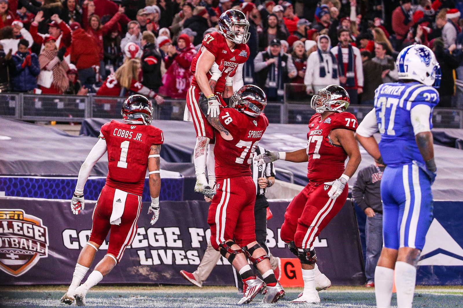 Indiana Hoosiers offensive lineman Jason Spriggs (78) celebrates with wide receiver Mitchell Paige (87) after scoring a touchdown during the 2015 New Era Pinstripe Bowl at Yankee Stadium. The Blue Devils won 44-41 in overtime.