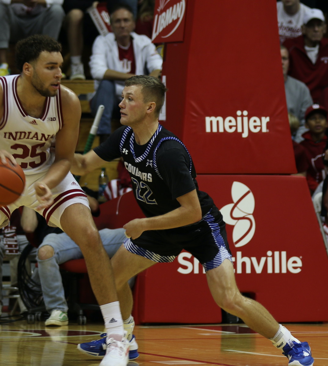 Brayton Bailey (right), the son of former Indiana great Damon Bailey, guards Hoosiers forward Race Thompson during the first half on Thursday. (Photo courtesy of Charlie Mager/Saint Francis)