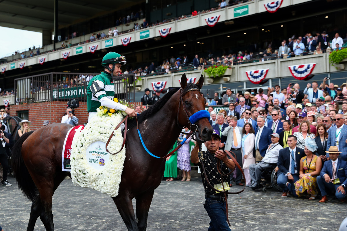 The Hill N Dale Metropolitan winner Flightline and jockey Flavien Prat are led into the winner s circle at Belmont Park Racetrack.