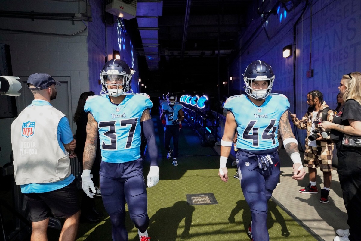 Tennessee Titans safety Amani Hooker (37) and fullback Tory Carter (44) head to the field to warm up before facing the Las Vegas Raiders at Nissan Stadium Sunday, Sept. 25, 2022, in Nashville, Tenn.