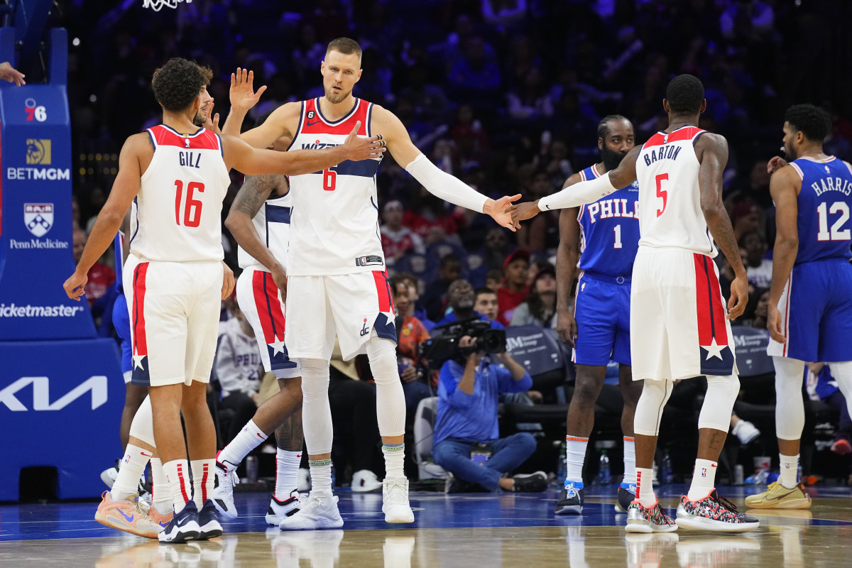 KP dapping up his teammates Anthony Gill and Will Barton. Photo Credit: USA Today Sports