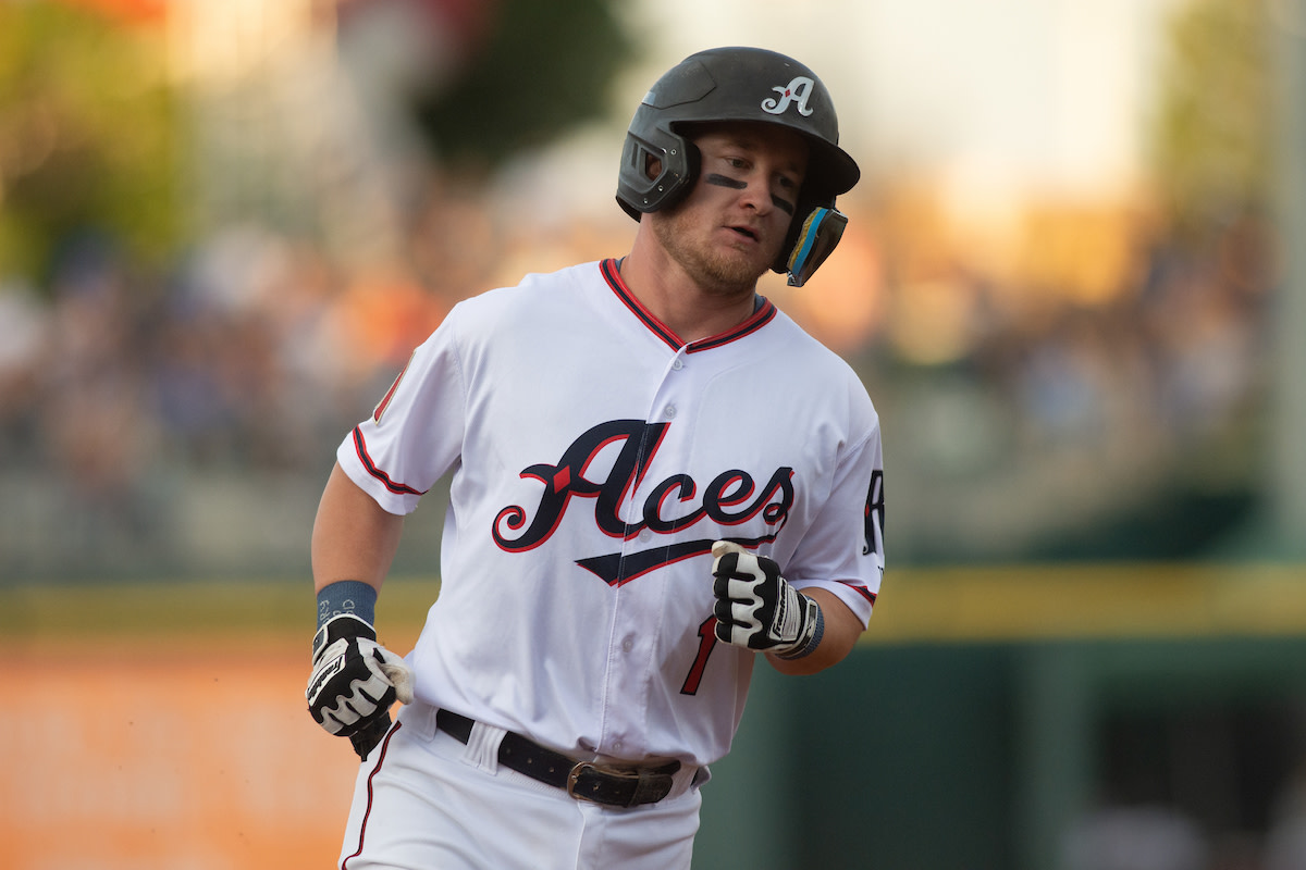 Camden Duzenack trots around the bases after hitting a home run for the Reno Aces.