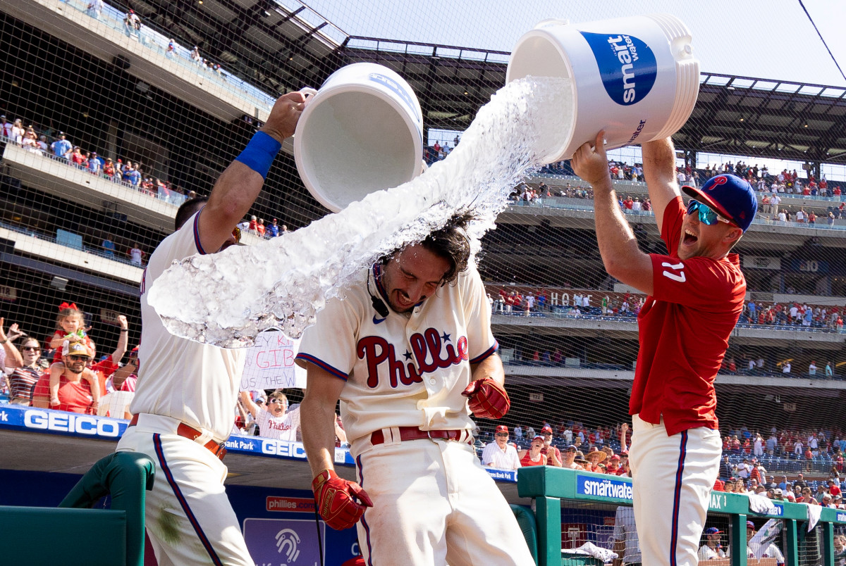 Phillies backup catcher Garrett Stubbs gets drenched with water after hitting a walk-off three-run home run against the Marlins on June 15, 2022.