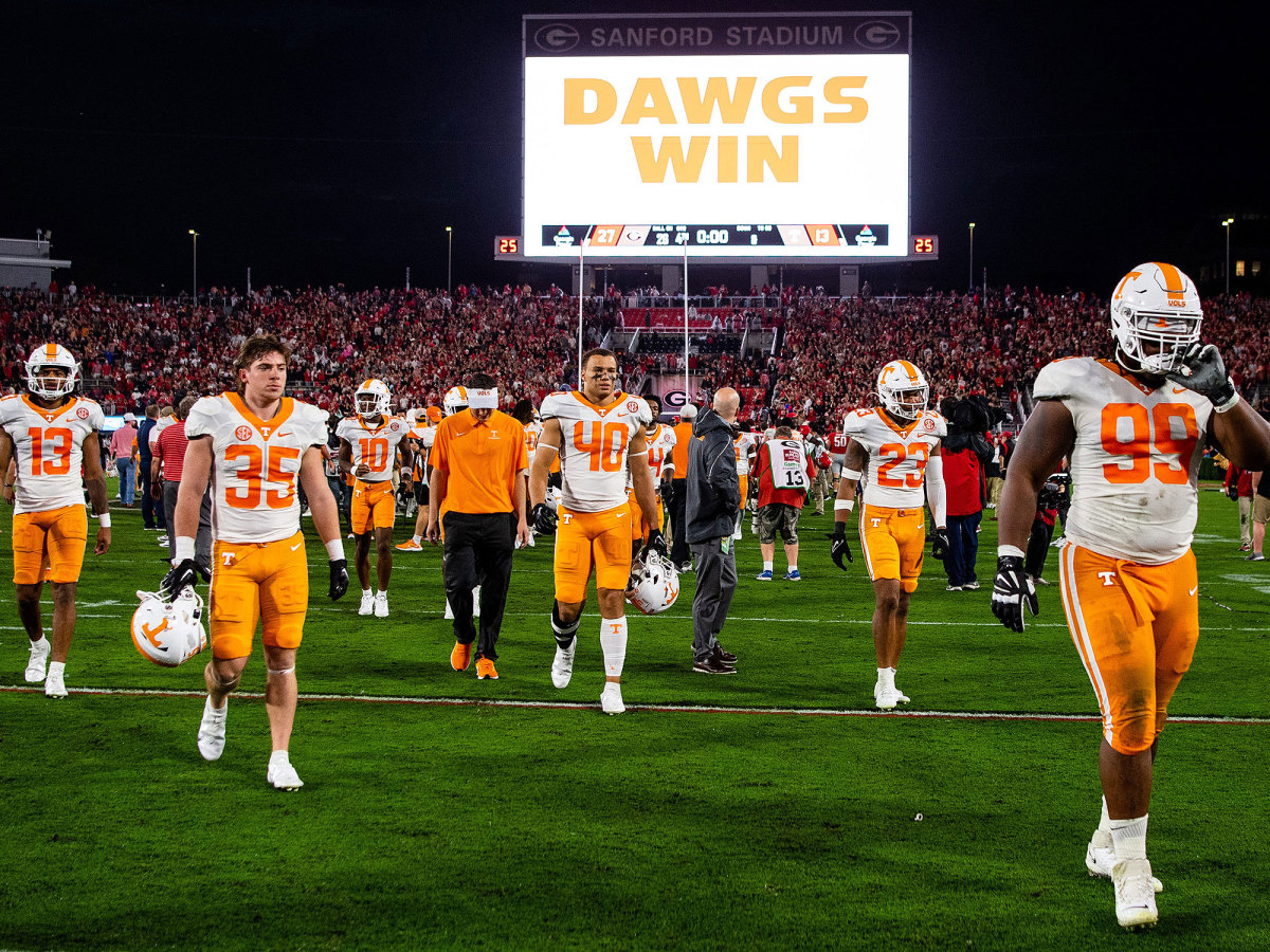 Dejected Tennessee players walk off the field at Sanford Stadium