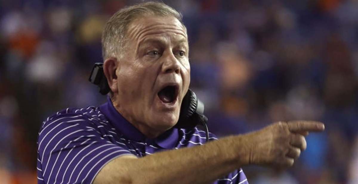 LSU Tigers head coach Brian Kelly on the sideline during a college football game in the SEC.