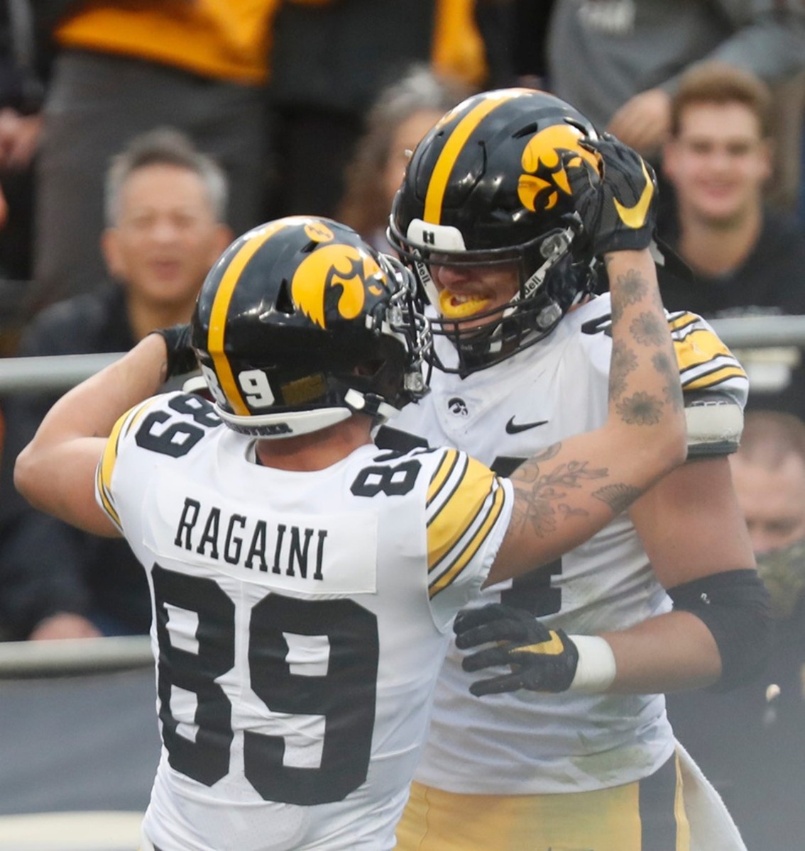 Iowa Hawkeyes tight end Sam LaPorta (84) celebrates with teammate Iowa Hawkeyes wide receiver Nico Ragaini (89) after scoring a touchdown during the NCAA football game against the Purdue Boilermakers, Saturday, Nov. 5, 2022, at Ross-Ade Stadium in West Lafayette, Ind.