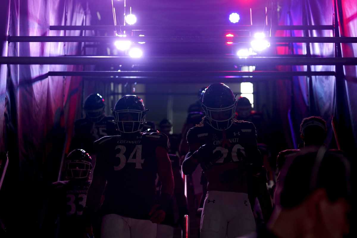 The Cincinnati Bearcats walk down to the field prior to the first quarter during a college football game against the Navy Midshipmen, Saturday, Nov. 5, 2022, at Nippert Stadium in Cincinnati. Ncaaf Navy Midshipmen At Cincinnati Bearcats Nov 6 0312