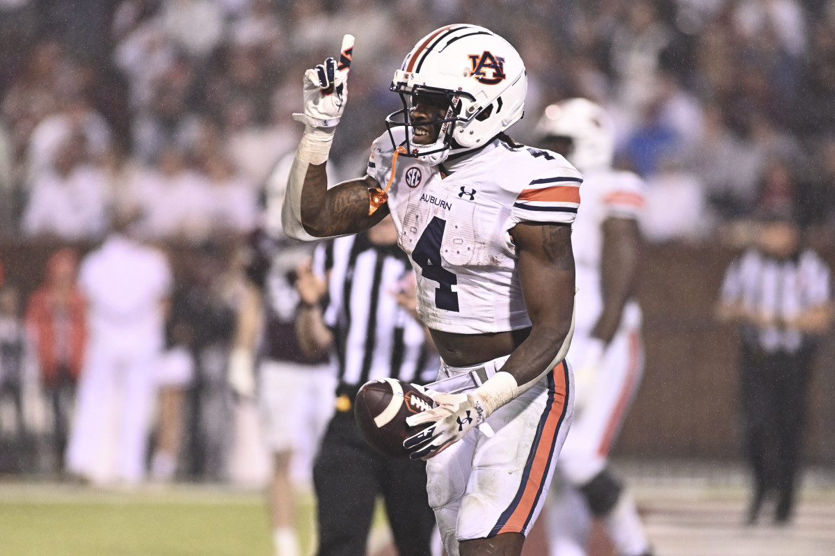 Nov 5, 2022; Starkville, Mississippi, USA; Auburn Tigers running back Tank Bigsby (4) reacts after a touchdown against the Mississippi State Bulldogs during the fourth quarter at Davis Wade Stadium at Scott Field. Mandatory Credit: Matt Bush-USA TODAY Sports