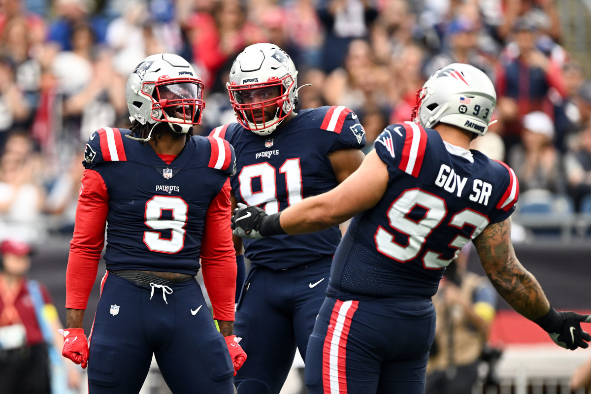 Nov 6, 2022; Foxborough, Massachusetts, USA; New England Patriots linebacker Matthew Judon (9), defensive end Deatrich Wise Jr. (91), and defensive end Lawrence Guy (93) react after sacking Indianapolis Colts quarterback Sam Ehlinger (not seen) during the first half at Gillette Stadium.
