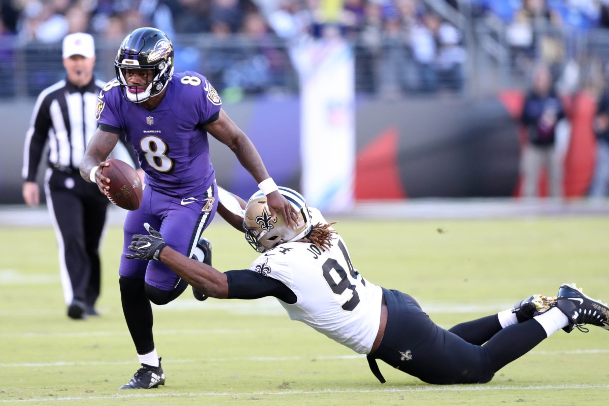 Oct 21, 2018; Baltimore Ravens quarterback Lamar Jackson (8) runs for a short gain against New Orleans Saints defensive end Cameron Jordan (94). Mandatory Credit: Mitch Stringer-USA TODAY Sports