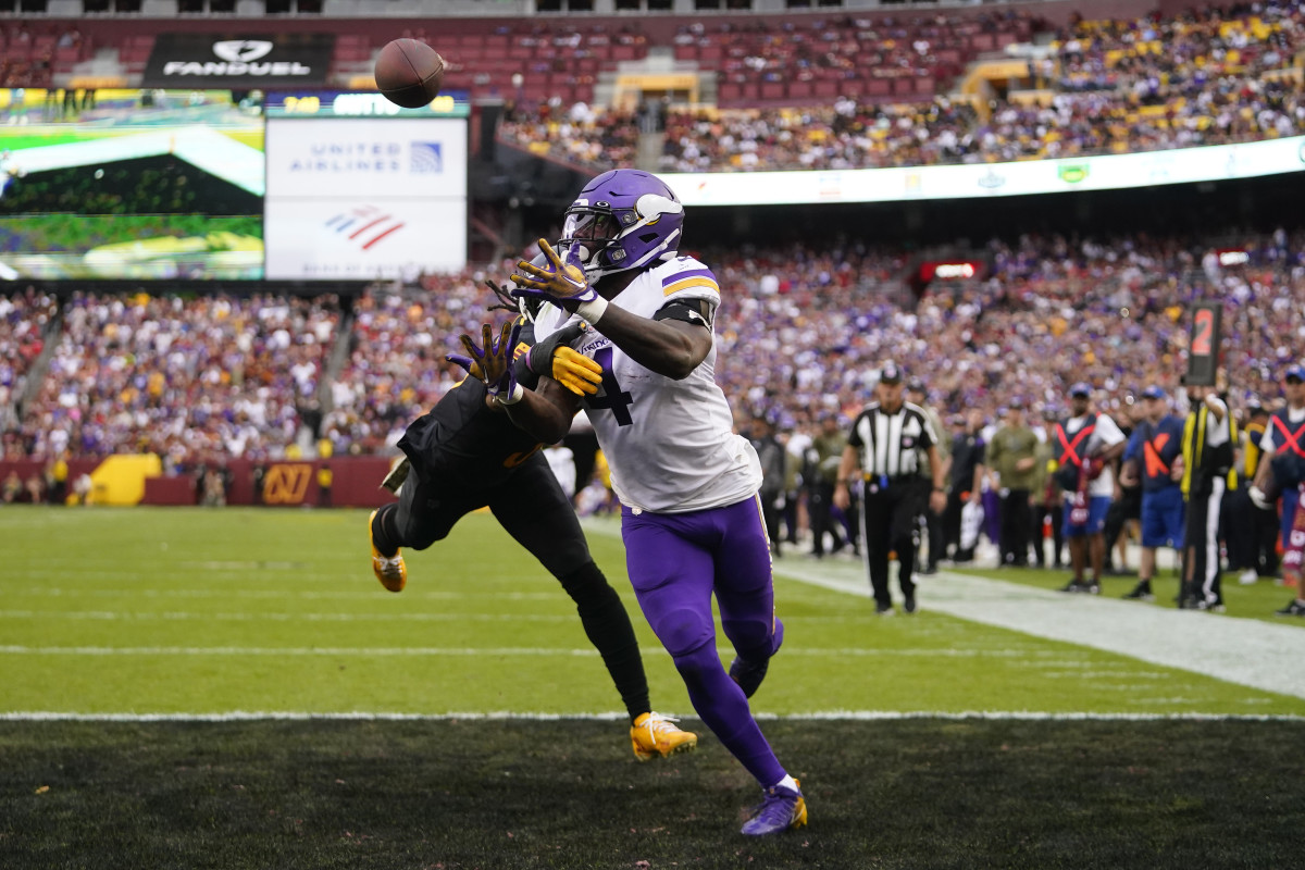 Dalvin Cook reaches for a touchdown catch against the Commanders.