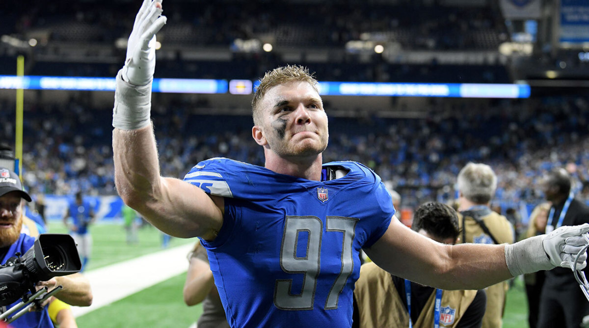 Lions defensive end Aidan Hutchinson celebrates his team's upset win over the Packers in Week 9.