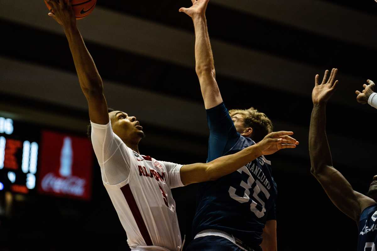 Alabama Crimson Tide guard Rylan Griffen (3) jumps to shoot as Longwood Lancers forward Jesper Granlund (35) attempts to block him at Coleman Coliseum Monday, Nov. 7, 2022, in the season opening game