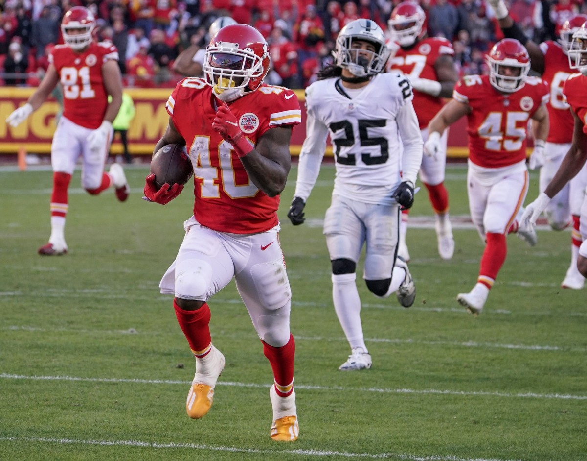 Dec 12, 2021; Kansas City Chiefs running back Derrick Gore (40) runs in for a touchdown as Las Vegas Raiders free safety Trevon Moehrig (25) chases. Mandatory Credit: Denny Medley-USA TODAY Sports