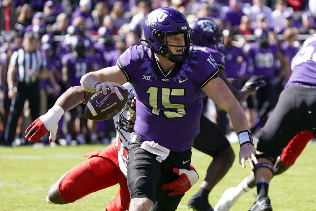 TCU Horned Frogs quarterback Max Duggan avoids the pressure from Texas Tech.