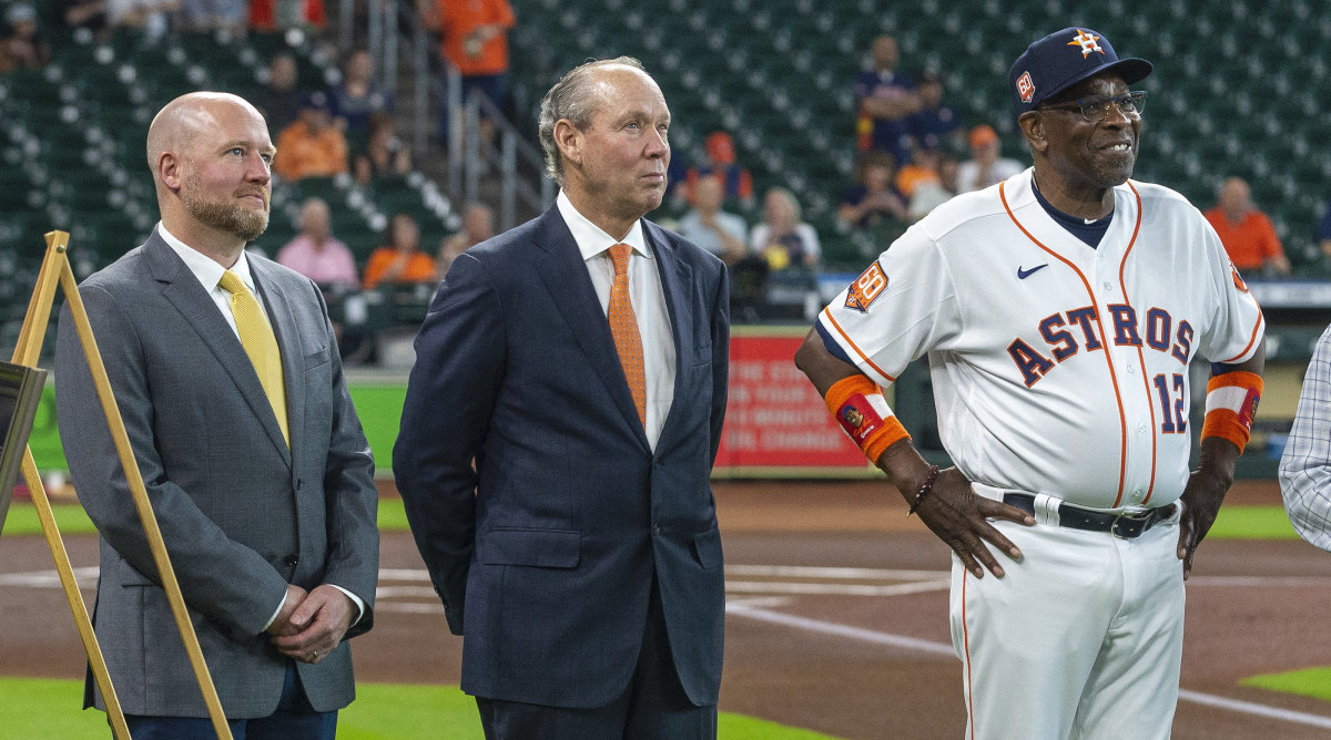 Astros GM James Click, left, with team owner Jim Crane, center, and manager Dusty Baker.