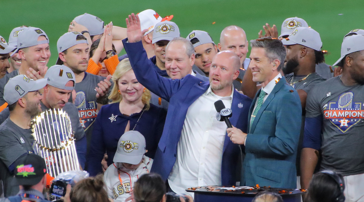 Astros GM James Click addresses the Minute Maid Park crowd after Houston won the 2022 World Series.