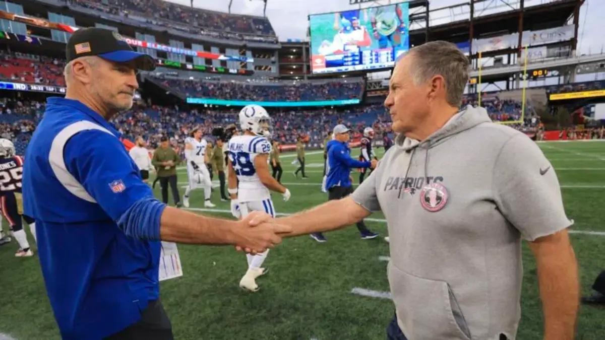 Reich (left) and Belichick shake hands after the Patriots' win over the Colts last year, the former's final game in Indianapolis.