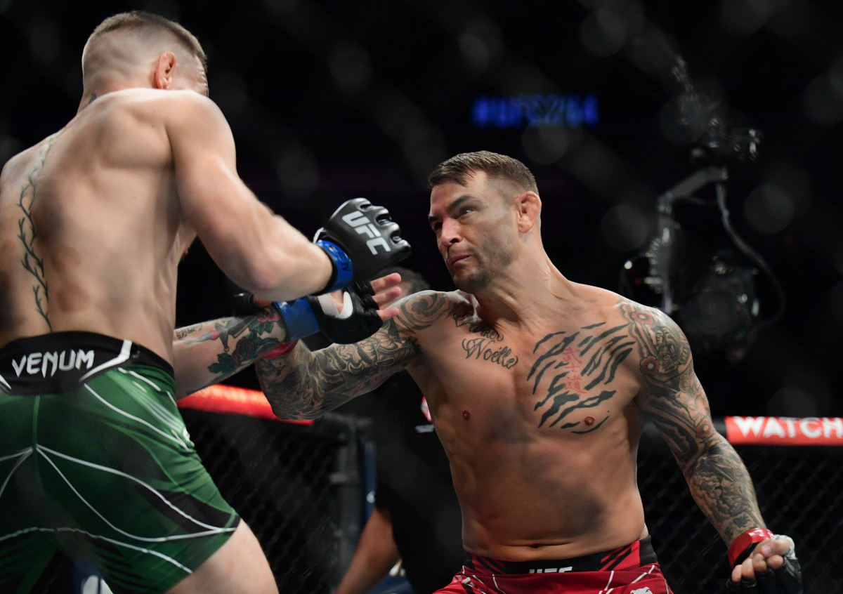 Dustin Poirier moves in for a hit against Conor McGregor during UFC 264 at T-Mobile Arena.