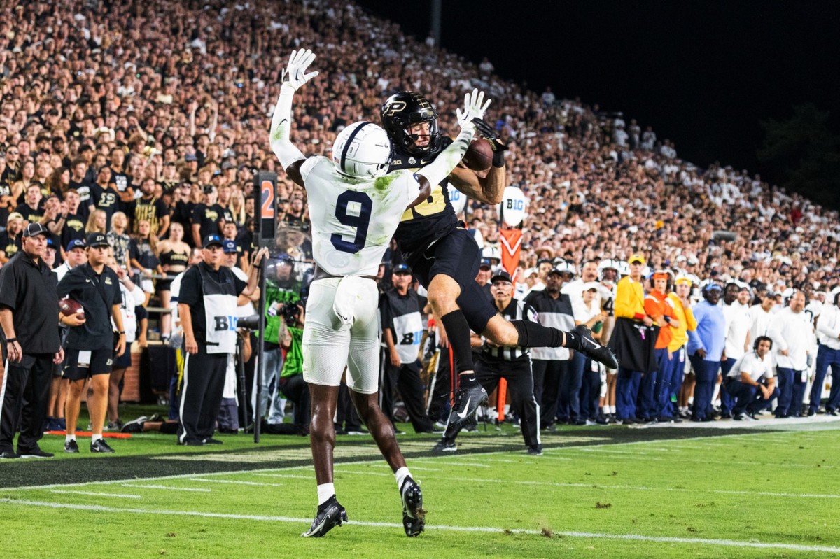 Sep 1, 2022; West Lafayette, Indiana, USA; Purdue Boilermakers wide receiver Charlie Jones (15) attempts to catch the ball while Penn State Nittany Lions cornerback Joey Porter Jr. (9) defends in the second half at Ross-Ade Stadium. Mandatory Credit: Trevor Ruszkowski-USA TODAY Sports