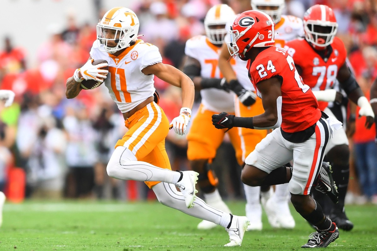 Tennessee wide receiver Jalin Hyatt (11) runs the ball while defended by Georgia defensive back Malaki Starks (24) during Tennessee's game against Georgia at Sanford Stadium in Athens, Ga., on Saturday, Nov. 5, 2022. Kns Vols Georgia Bp