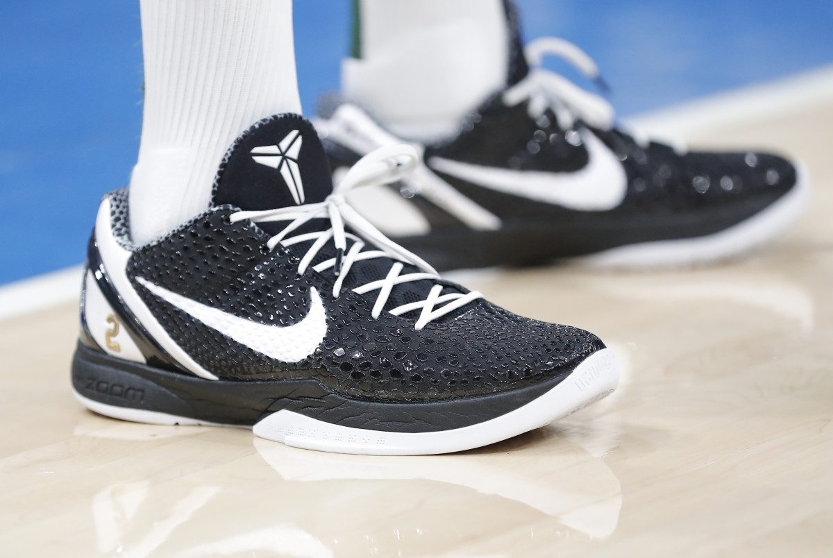 View of black and white Nike Kobe shoes.
