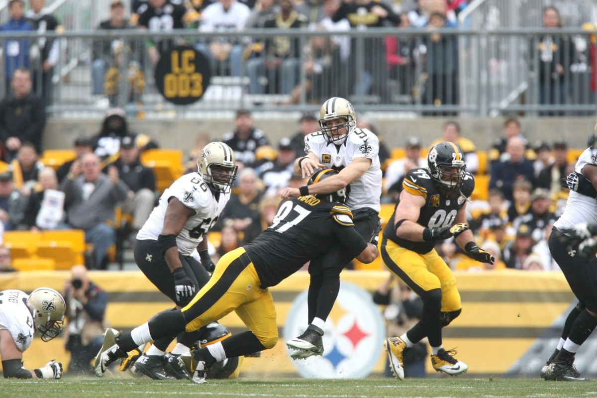 Nov 30, 2014; Pittsburgh Steelers defensive end Cameron Heyward (97) hits New Orleans Saints quarterback Drew Brees (9) as he throws. Mandatory Credit: Jason Bridge-USA TODAY Sports