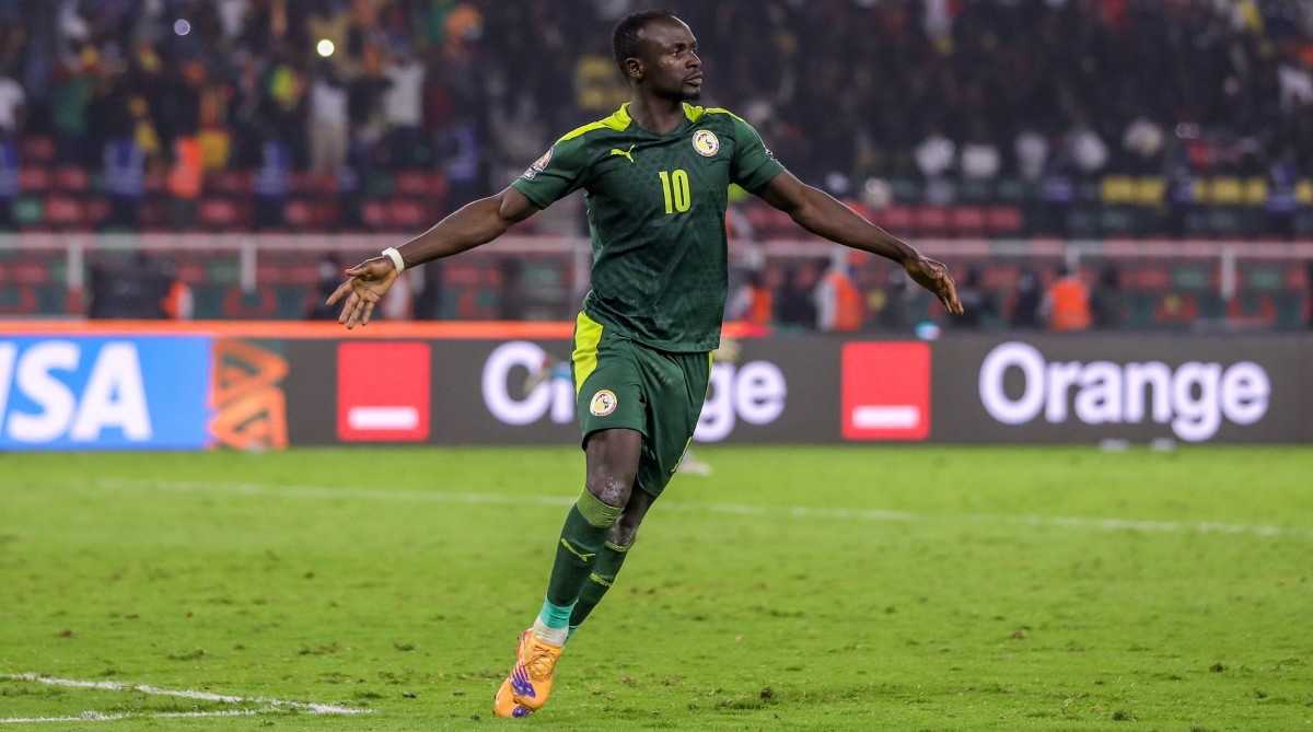 Sadio Mane of Senegal celebrates after scoring winning penalty during the Africa Cup of Nations Final.