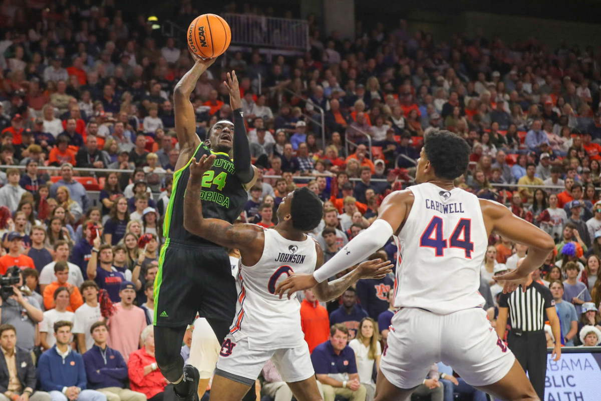 KD Johnson and Dylan Cardwell defend South Florida for Auburn basketball.