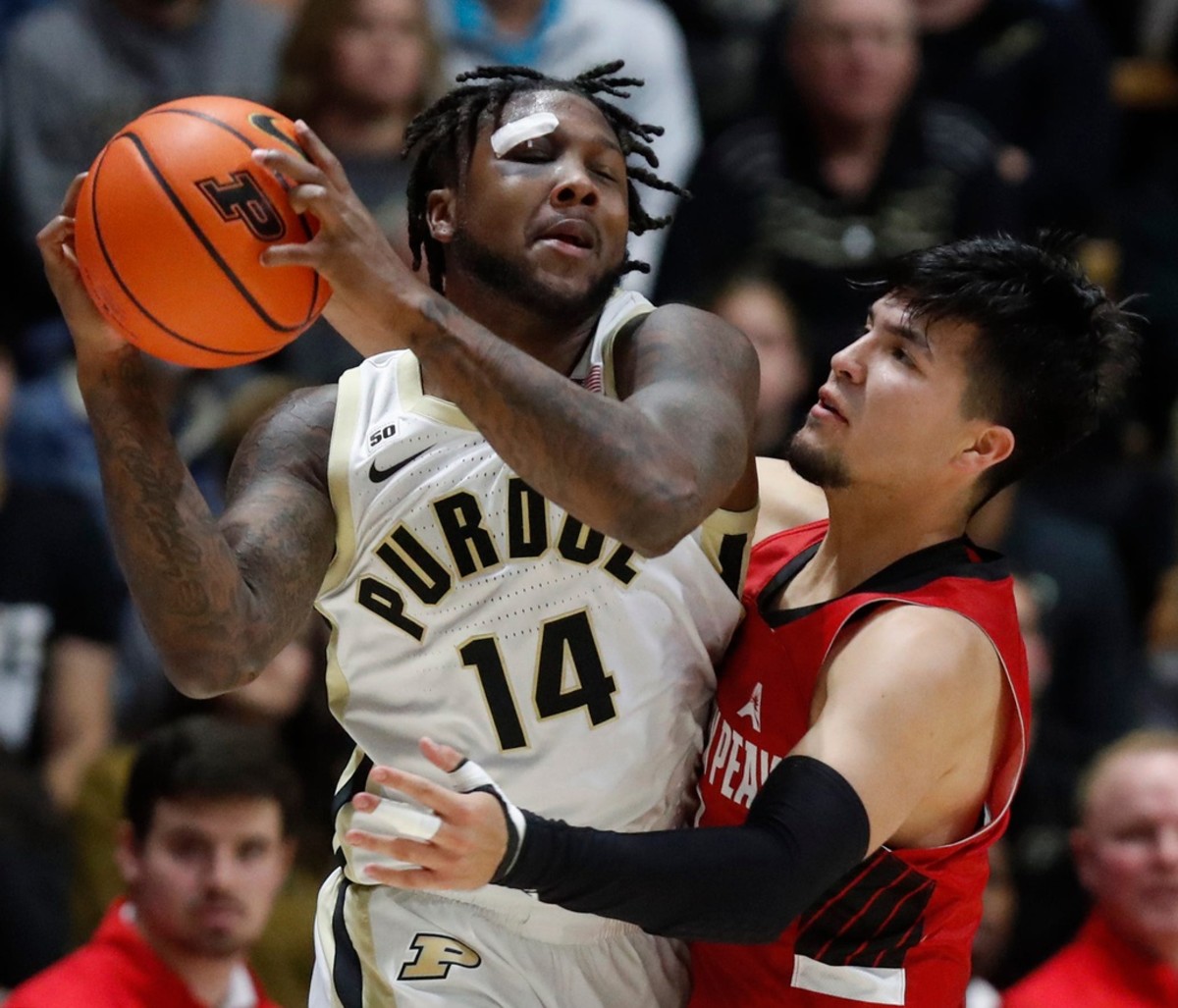 Purdue Boilermakers guard David Jenkins Jr. (14) is fouled by Austin Peay Governors guard Carlos Paez (1) during NCAA men s basketball game, Friday, Nov. 11, 2022, at Mackey Arena in West Lafayette, Ind.