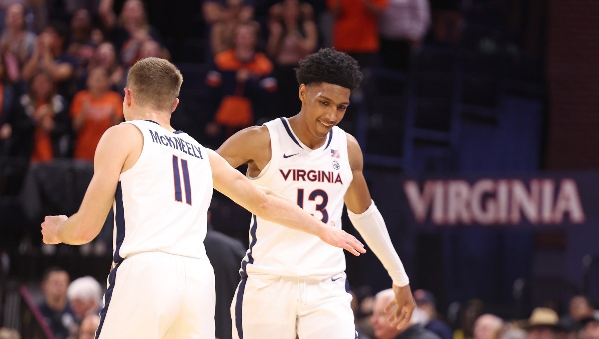 Isaac McKneely and Ryan Dunn celebrate during the Virginia men's basketball game against Monmouth at John Paul Jones Arena.