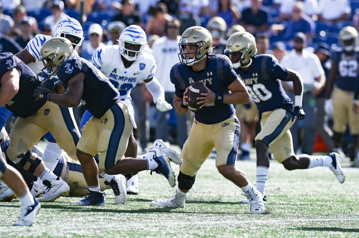 Navy Midshipmen quarterback Tai Lavatai (1) runs with the ball during the first half against the Memphis Tigers at Navy-Marine Corps Memorial Stadium.