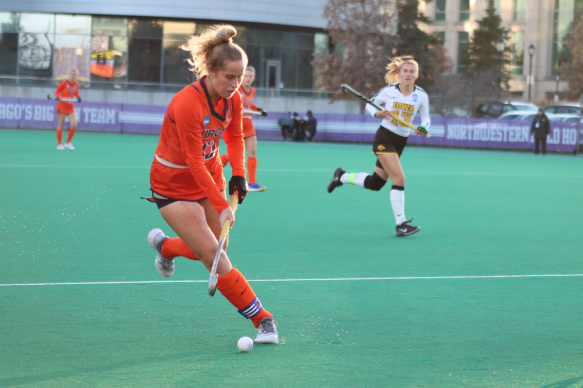 Laura Janssen moves the ball ahead during the Virginia field hockey game against Iowa in the NCAA Field Hockey Championships in Evanston, Illinois.