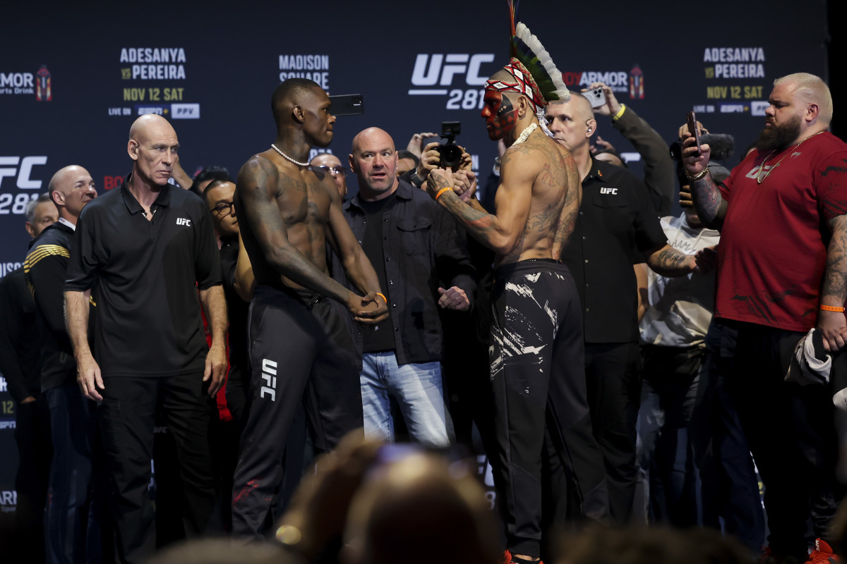 Israel Adesanya and Alex Pereira interact during weigh-ins for UFC 281.